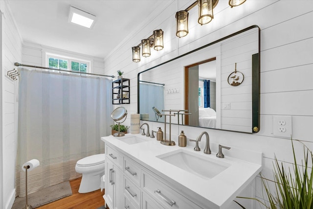 411 Hessel Blvd, Champaign, IL 61820 - full bath with double vanity, wood finished floors, a shower with curtain, and ensuite bath