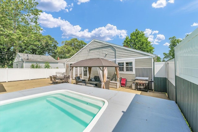 411 Hessel Blvd, Champaign, IL 61820 - back of house featuring a deck, a gazebo, outdoor lounge area, and a fenced backyard