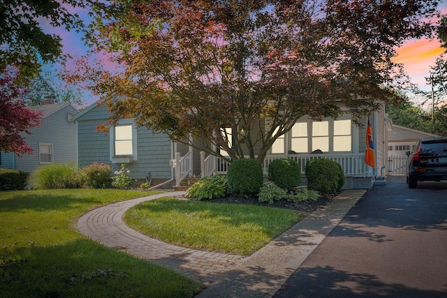 411 Hessel Blvd, Champaign, IL 61820 - view of front of home with a lawn and a garage