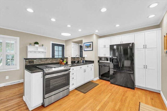 411 Hessel Blvd, Champaign, IL 61820 - kitchen with appliances with stainless steel finishes, crown molding, light wood finished floors, white cabinetry, and recessed lighting