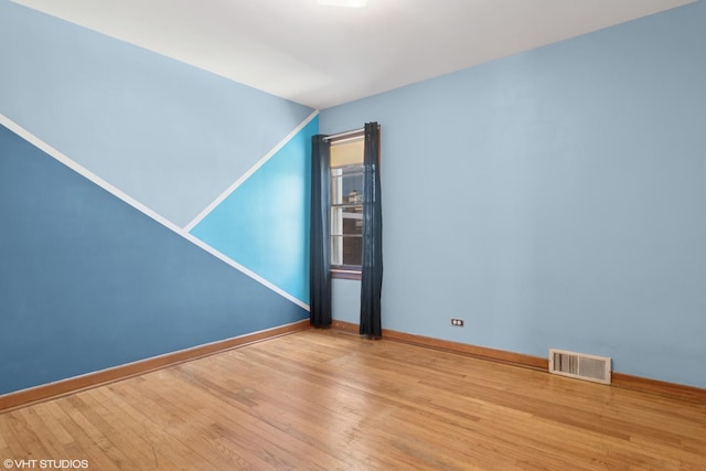 8024 W Charmaine Rd, Norridge, IL 60706 - spare room with wood finished floors and baseboards