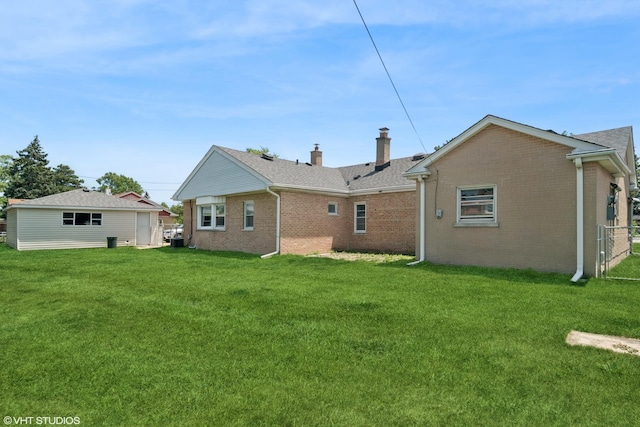 8024 W Charmaine Rd, Norridge, IL 60706 - back of property featuring brick siding, a chimney, and a lawn
