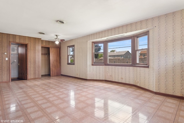 8024 W Charmaine Rd, Norridge, IL 60706 - empty room with plenty of natural light, ceiling fan, and light flooring