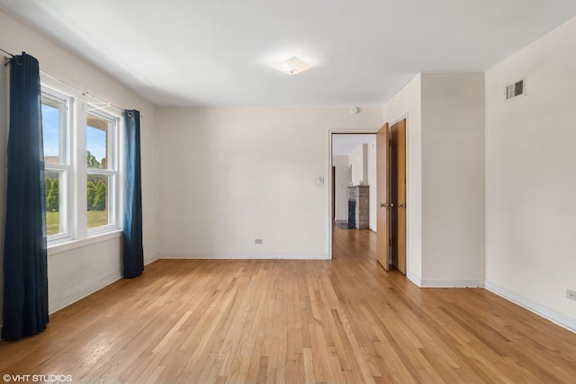 8024 W Charmaine Rd, Norridge, IL 60706 - spare room with light wood finished floors and baseboards
