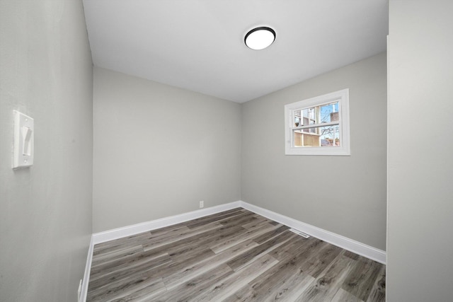 10823 S Ewing Ave, Chicago, IL 60617 - empty room with wood finished floors and baseboards