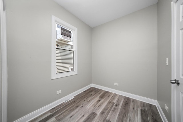 10823 S Ewing Ave, Chicago, IL 60617 - empty room featuring wood finished floors and baseboards