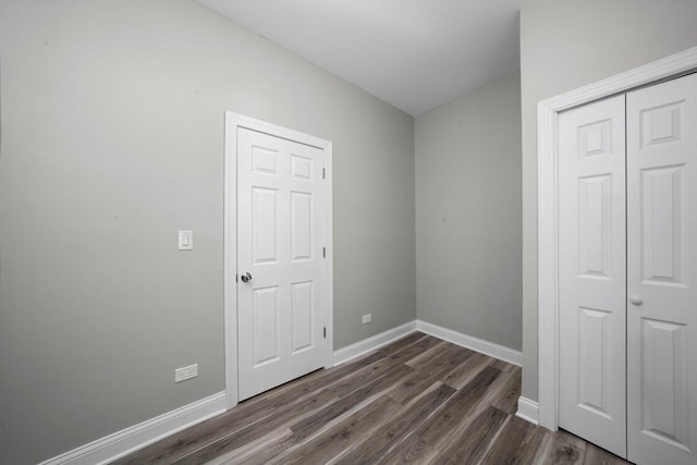 10823 S Ewing Ave, Chicago, IL 60617 - unfurnished bedroom with dark wood-style floors and a closet