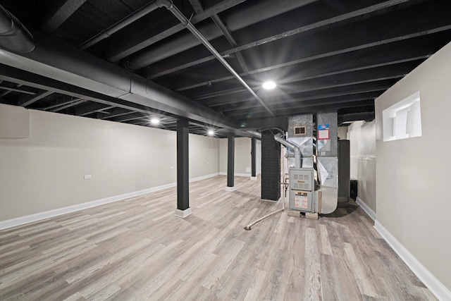 10823 S Ewing Ave, Chicago, IL 60617 - finished below grade area featuring wood finished floors and heating unit