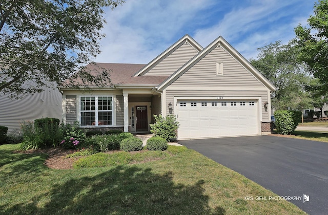 1114 Barkston Ln, Aurora, IL 60502 - view of front of property with driveway, an attached garage, a front yard, and roof with shingles