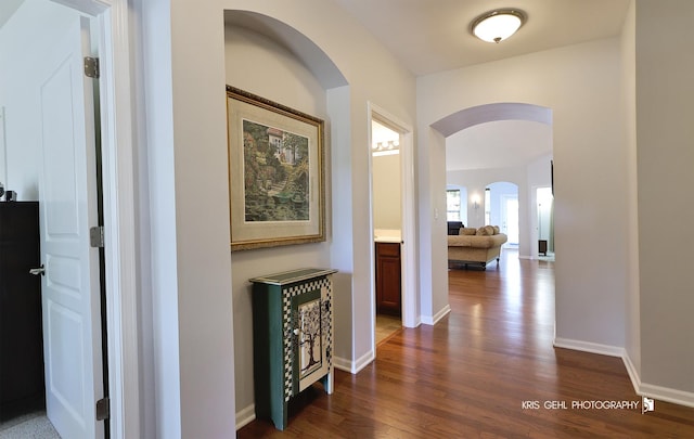 1114 Barkston Ln, Aurora, IL 60502 - corridor with arched walkways and dark wood-style flooring