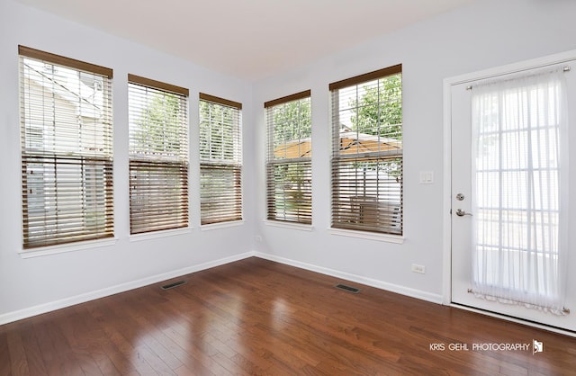 1114 Barkston Ln, Aurora, IL 60502 - unfurnished sunroom featuring baseboards and wood finished floors
