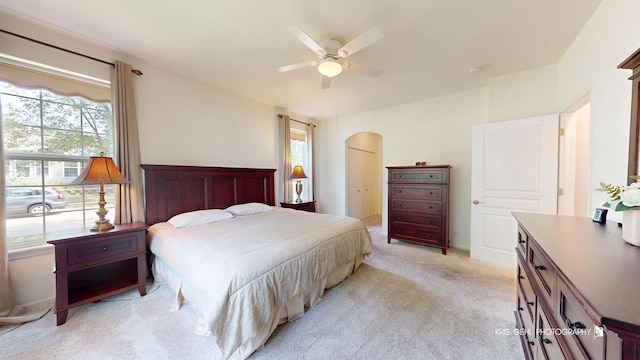 1114 Barkston Ln, Aurora, IL 60502 - bedroom featuring arched walkways, light colored carpet, a ceiling fan, and a closet