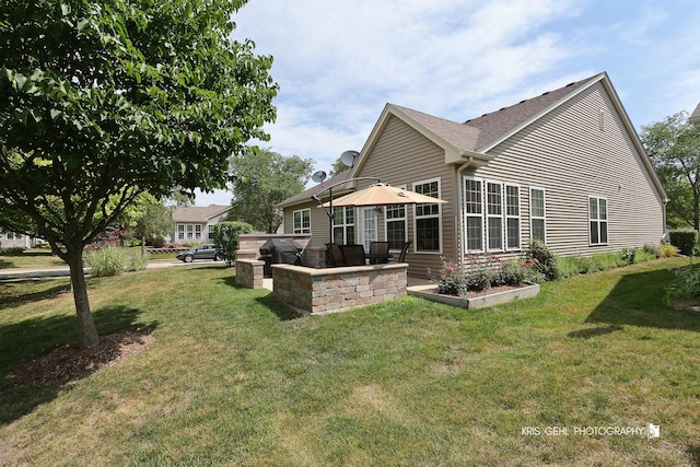 1114 Barkston Ln, Aurora, IL 60502 - rear view of property featuring a lawn and a patio area