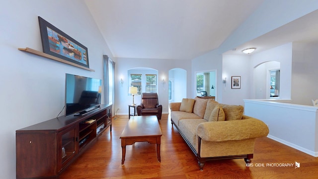 1114 Barkston Ln, Aurora, IL 60502 - living area with arched walkways, wood finished floors, and vaulted ceiling