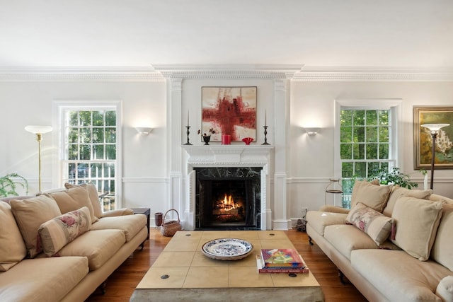 424 Sheridan Rd, Kenilworth, IL 60043 - living room featuring ornamental molding, a premium fireplace, wood finished floors, and plenty of natural light