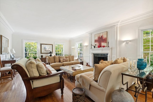 424 Sheridan Rd, Kenilworth, IL 60043 - living area featuring ornamental molding, plenty of natural light, wood finished floors, and a fireplace