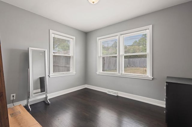 251 W 10th St, Chicago Heights, IL 60411 - unfurnished living room featuring dark wood-style floors and baseboards