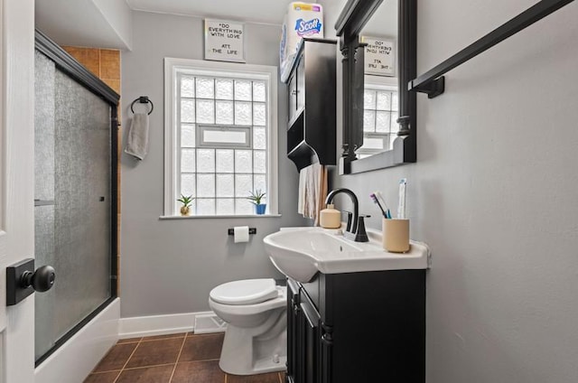 251 W 10th St, Chicago Heights, IL 60411 - bathroom with vanity, healthy amount of natural light, tile patterned floors, and shower / bath combination with glass door
