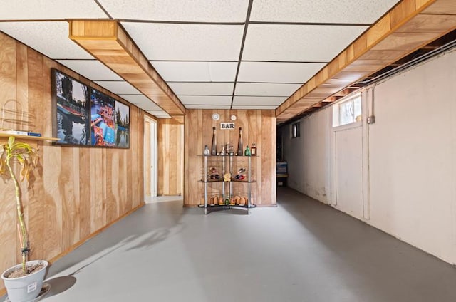251 W 10th St, Chicago Heights, IL 60411 - below grade area featuring wood walls, a paneled ceiling, and a dry bar
