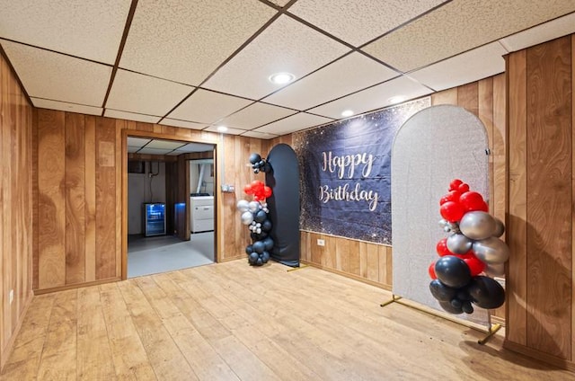 251 W 10th St, Chicago Heights, IL 60411 - exercise room featuring wood walls, hardwood / wood-style floors, washer / dryer, a drop ceiling, and wine cooler