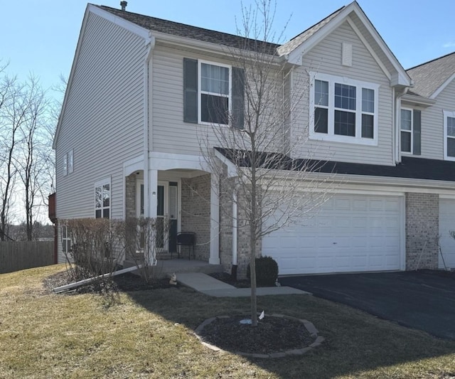 1321 Acorn Dr, Crest Hill, IL 60403 - view of front of property with covered porch, an attached garage, asphalt driveway, and brick siding