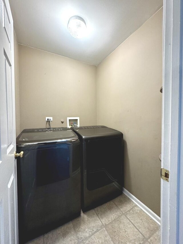 1321 Acorn Dr, Crest Hill, IL 60403 - laundry room with separate washer and dryer and baseboards