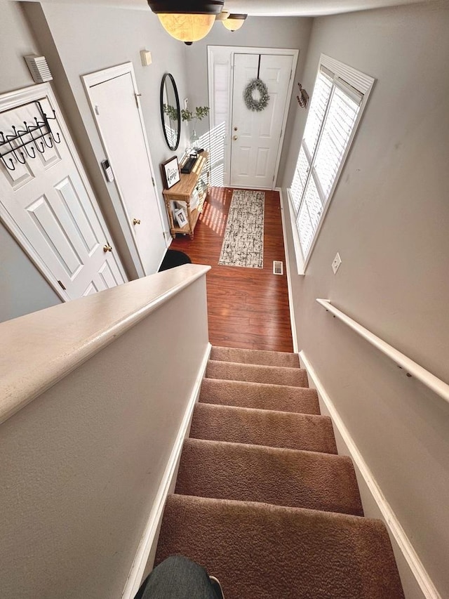 1321 Acorn Dr, Crest Hill, IL 60403 - stairway featuring wood finished floors and baseboards