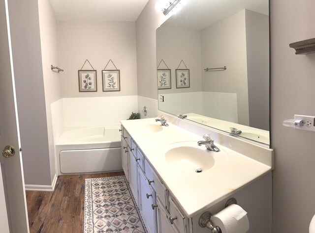 1321 Acorn Dr, Crest Hill, IL 60403 - bathroom featuring wood finished floors, double vanity, and a garden tub