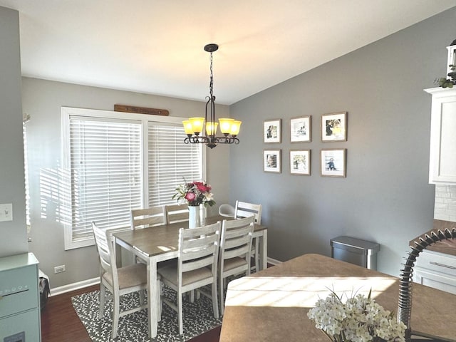 1321 Acorn Dr, Crest Hill, IL 60403 - dining space featuring a chandelier, dark wood-type flooring, and vaulted ceiling