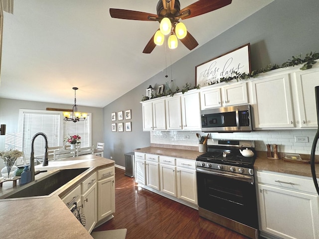 1321 Acorn Dr, Crest Hill, IL 60403 - kitchen featuring stainless steel appliances, lofted ceiling, backsplash, dark wood-type flooring, and white cabinets
