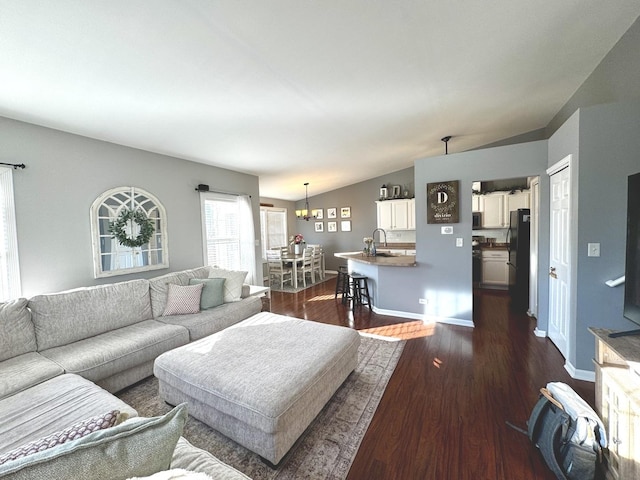 1321 Acorn Dr, Crest Hill, IL 60403 - living area with vaulted ceiling, dark wood-type flooring, and a chandelier