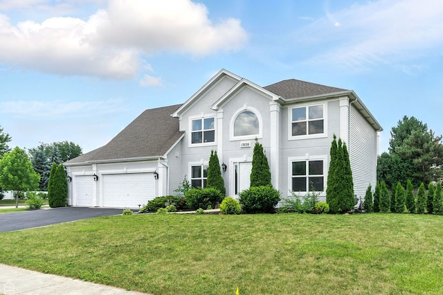 13636 Savanna Dr, Plainfield, IL 60544 - traditional-style home with asphalt driveway, an attached garage, a front lawn, and stucco siding