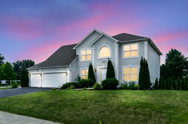 13636 Savanna Dr, Plainfield, IL 60544 - traditional-style home featuring driveway, a garage, a front lawn, and stucco siding