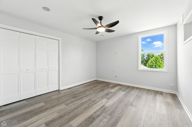 13636 Savanna Dr, Plainfield, IL 60544 - unfurnished bedroom featuring light wood finished floors, a closet, and a ceiling fan