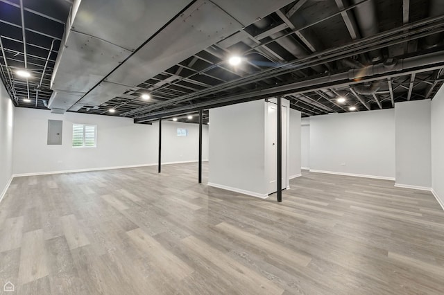 13636 Savanna Dr, Plainfield, IL 60544 - basement featuring electric panel and wood finished floors