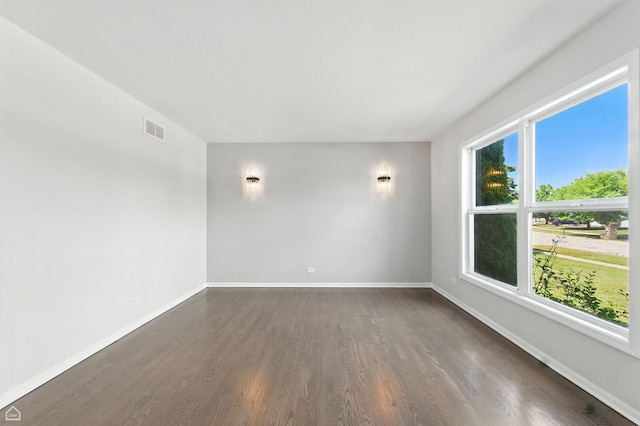 13636 Savanna Dr, Plainfield, IL 60544 - spare room featuring dark wood-style flooring and baseboards