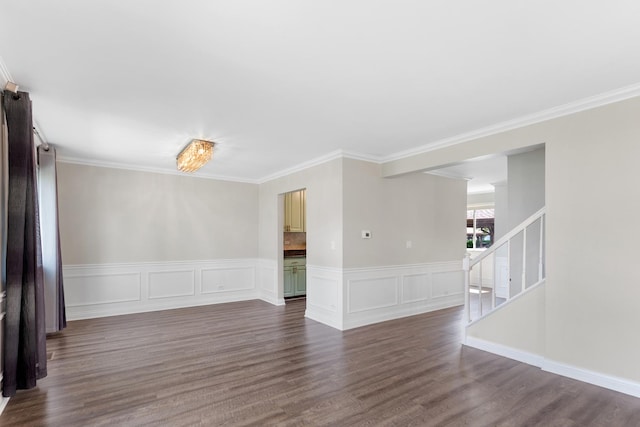 496 Navajo Trl S Unit 496, Wheeling, IL 60090 - spare room with dark wood-style flooring, stairs, ornamental molding, and wainscoting