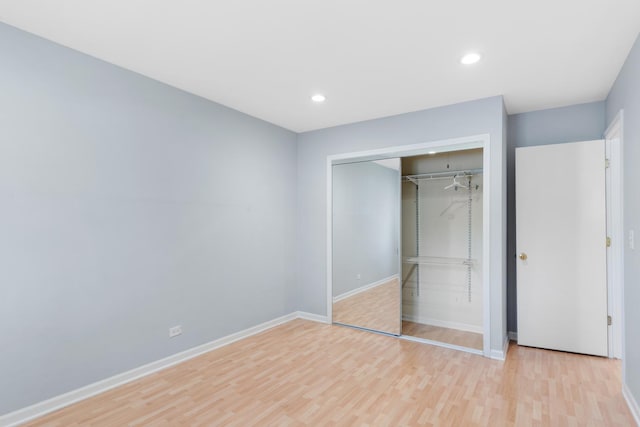 496 Navajo Trl S Unit 496, Wheeling, IL 60090 - unfurnished bedroom with light wood-type flooring, a closet, and recessed lighting