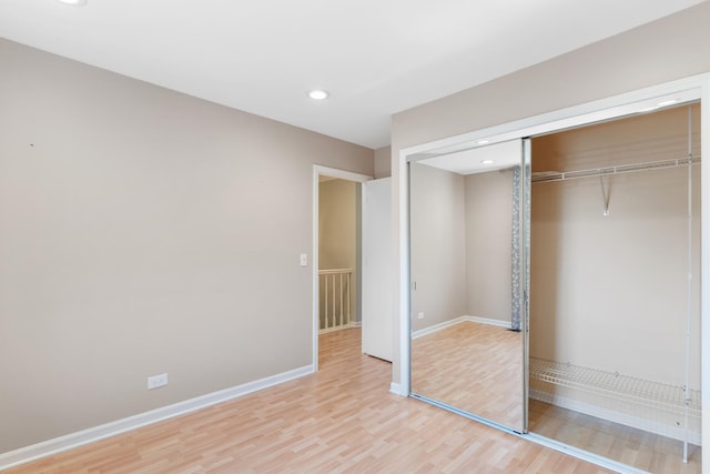 496 Navajo Trl S Unit 496, Wheeling, IL 60090 - unfurnished bedroom featuring light wood-style flooring, a closet, and recessed lighting