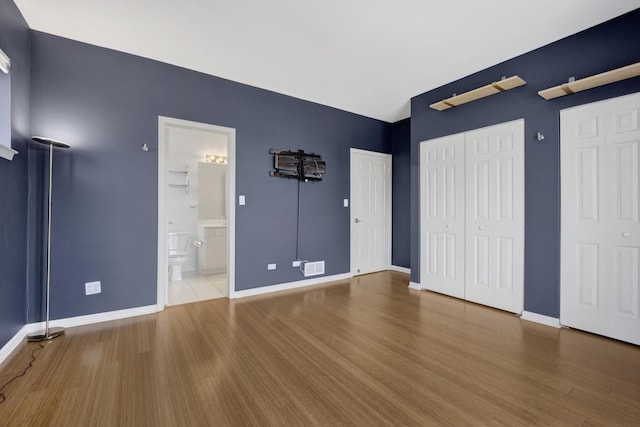 1414 S Halsted St Unit 3A, Chicago, IL 60607 - unfurnished bedroom featuring wood finished floors and ensuite bath