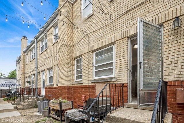 337 Wesley Ave Unit C, Oak Park, IL 60302 - view of home's exterior with a central air condition unit and brick siding
