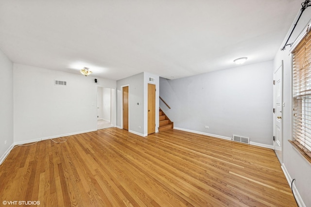 337 Wesley Ave Unit C, Oak Park, IL 60302 - empty room featuring stairway and light wood-style flooring