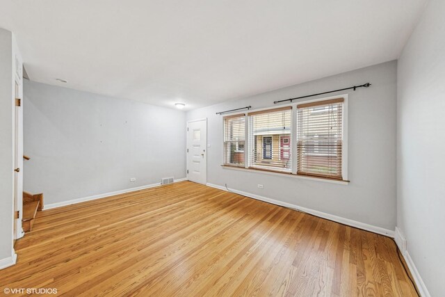 337 Wesley Ave Unit C, Oak Park, IL 60302 - unfurnished room with light wood finished floors and stairway