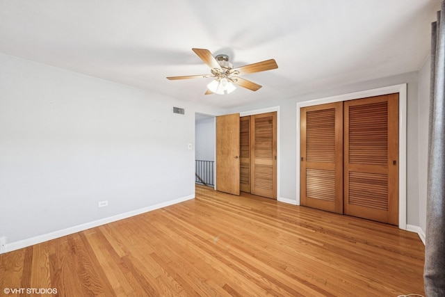 337 Wesley Ave Unit C, Oak Park, IL 60302 - unfurnished bedroom featuring multiple closets, light wood finished floors, and a ceiling fan