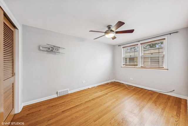 337 Wesley Ave Unit C, Oak Park, IL 60302 - unfurnished bedroom with a closet, light wood-type flooring, and a ceiling fan