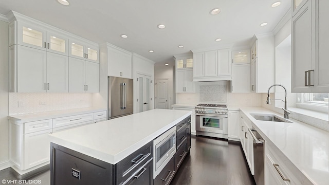 392 Spruce Rd, Wood Dale, IL 60191 - kitchen with high quality appliances, white cabinetry, recessed lighting, light countertops, and a center island