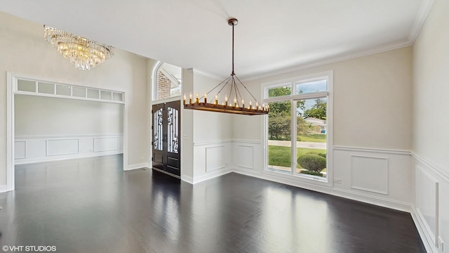 392 Spruce Rd, Wood Dale, IL 60191 - unfurnished dining area featuring a chandelier, dark wood-type flooring, crown molding, and wainscoting