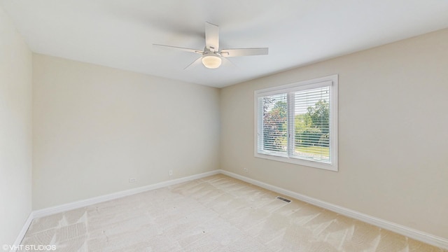 392 Spruce Rd, Wood Dale, IL 60191 - spare room featuring light colored carpet and ceiling fan