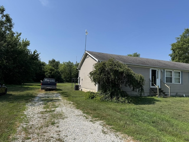810 Harding Ave, Gillespie, IL 62033 - view of property exterior with entry steps, driveway, and a lawn