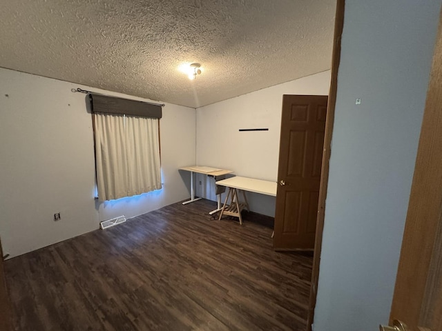 810 Harding Ave, Gillespie, IL 62033 - unfurnished office with wood finished floors, a textured ceiling, and vaulted ceiling